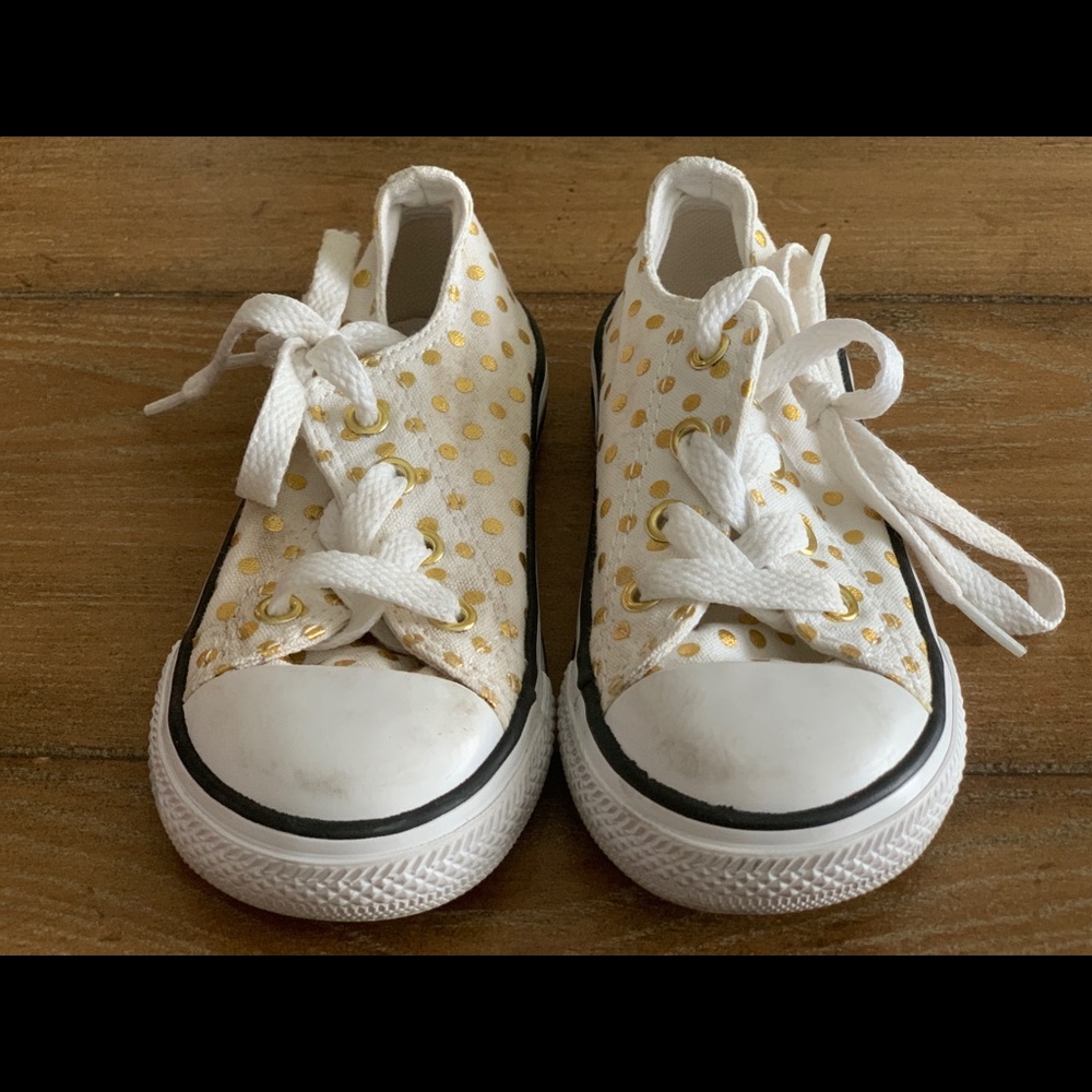 Gold and white Converse All-Stars (Chuck Taylor’s)